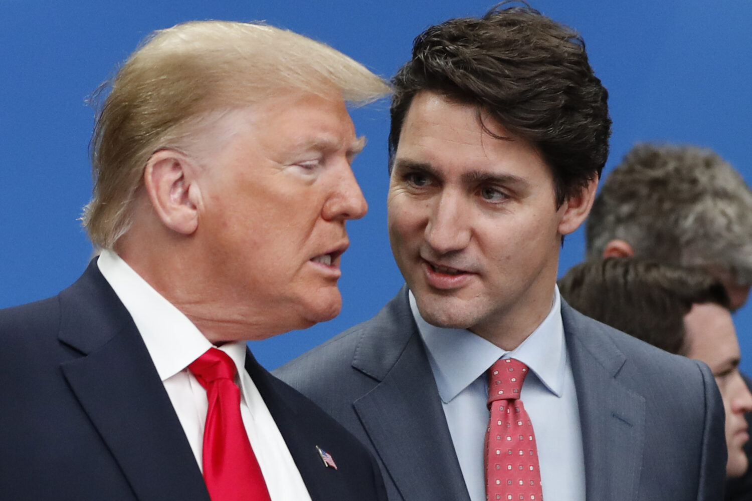 FILE - U.S. President Donald Trump, left, and Canadian Prime Minister Justin Trudeau talk prior to ...