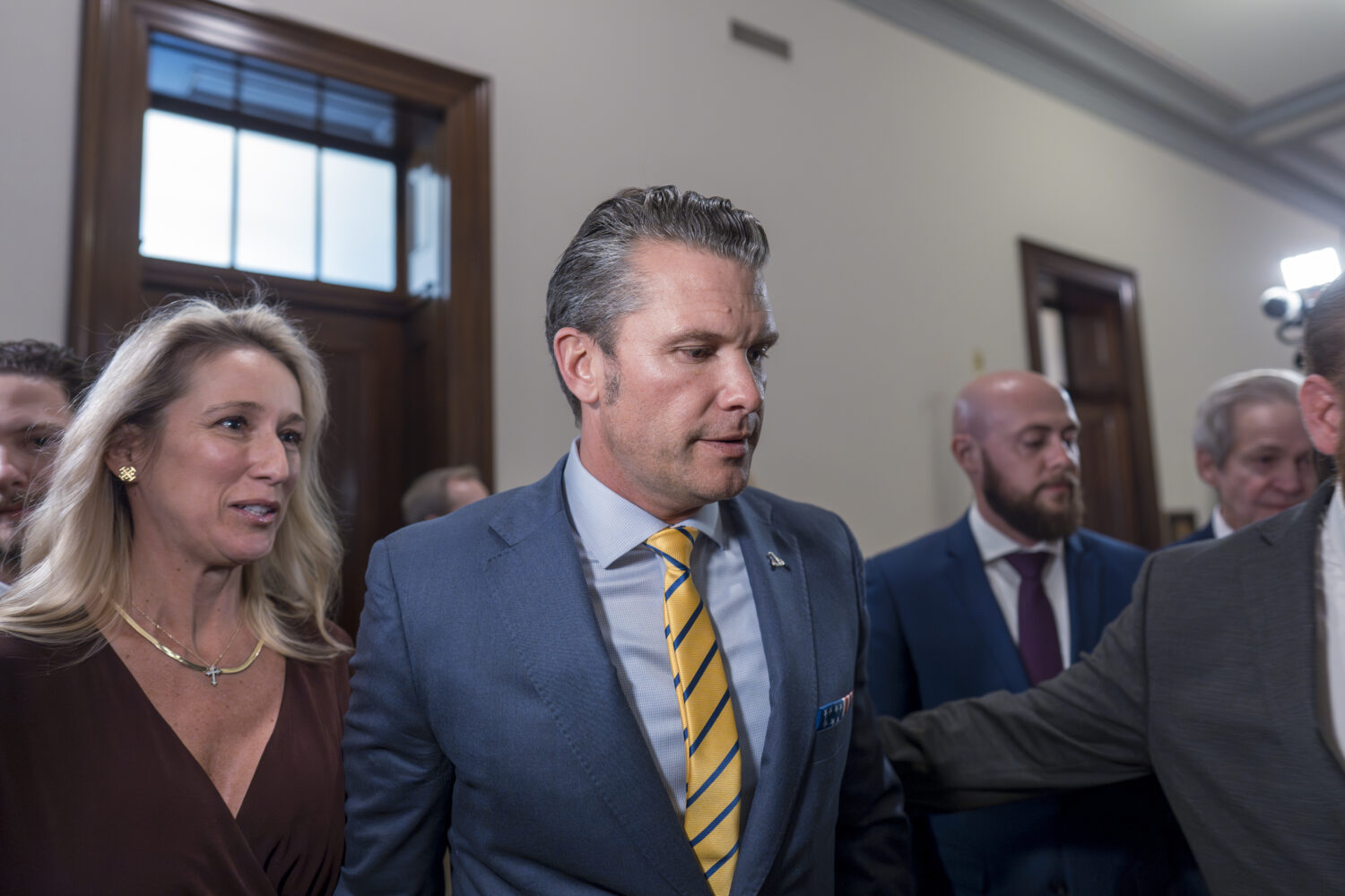 Pete Hegseth, President-elect Donald Trump's nominee to be defense secretary, is joined by his wife...