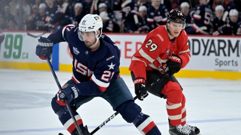 Team United States forward Dylan Larkin and Team Canada forward Nathan MacKinnon