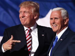 CLEVELAND, OH - JULY 20: Republican presidential candidate Donald Trump stands with Republican vice presidential candidate Mike Pence and acknowledge the crowd on the third day of the Republican National Convention on July 20, 2016 at the Quicken Loans Arena in Cleveland, Ohio.