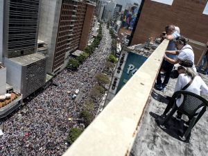 Thousands of demonstrators protesting against President Nicolas Maduro's government march in Caracas on April 8, 2017.