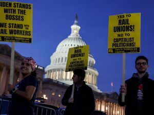 Activists in support of unionized rail workers protest outside the U.S. Capitol Building.