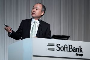 Masayoshi Son in a black suit.