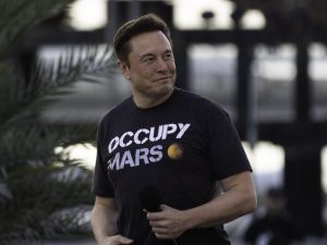 Elon Musk wearing a black shirt.