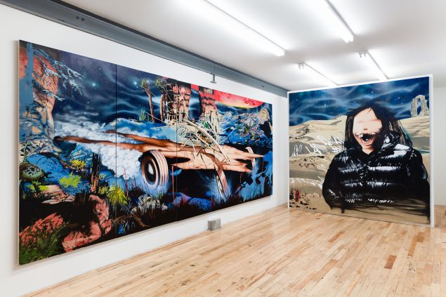 Image of two large scale paintings hanging on walls in gallery