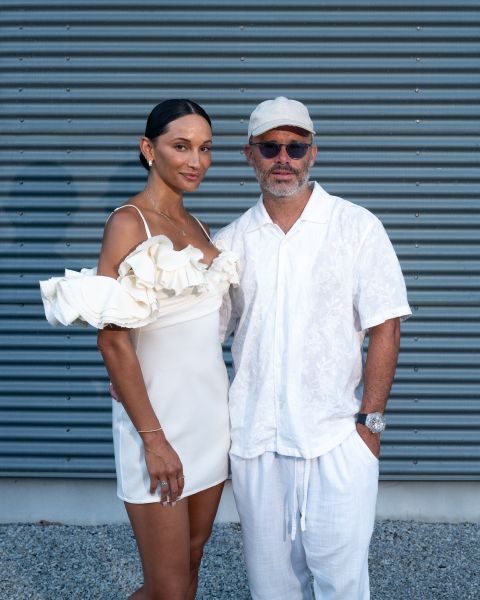 A man and a woman dressed in white.