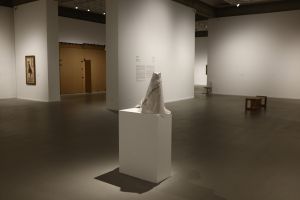 An eerie empty art museum with wrapped sculpture