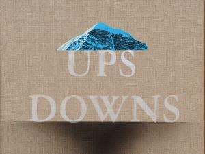 Linen canvas with phrase "UPS DOWNS" written in white