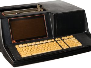 Bulky desktop computer with light orange keyboard