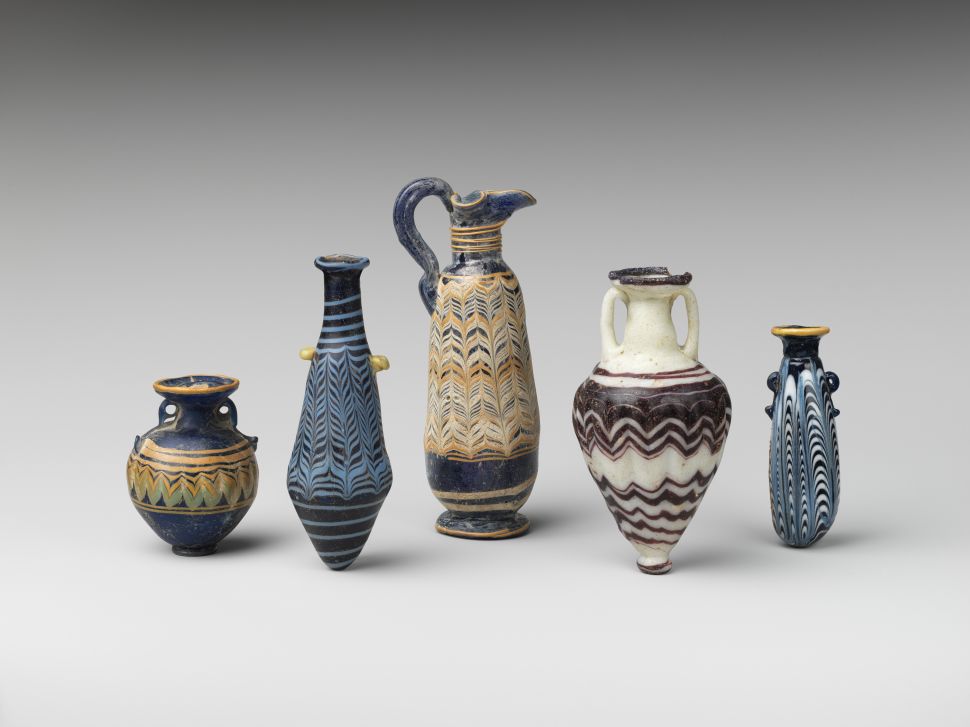 A lineup of five antique perfume bottles from Greece