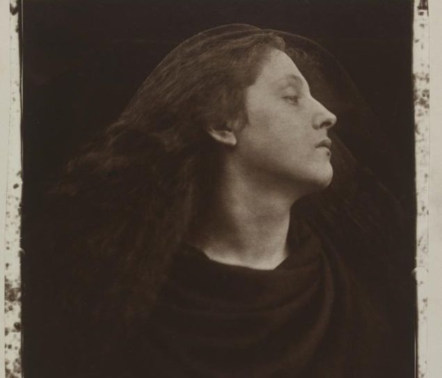 A sepia photo of a woman looking dramatically off to the left