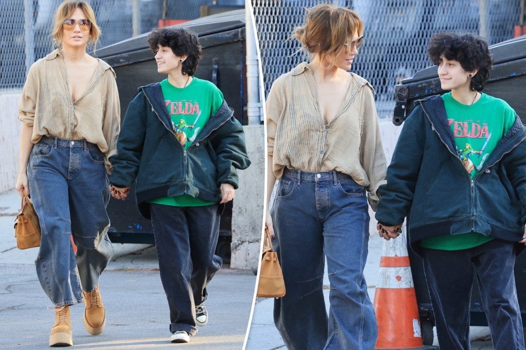 Jennifer Lopez and child Emme, 16, hold hands during flea market outing