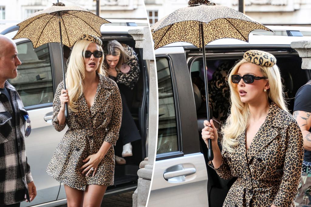 Millie Bobby Brown rocks head-to-toe leopard print — including a chic mini umbrella — in London