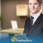 A man in a suit and tie standing in front of a desk considering payday loans in Philadelphia