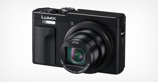 A black Lumix digital camera with a prominent lens and Leica branding is shown against a plain white background. The camera features several control dials on the top and a textured grip on the side.