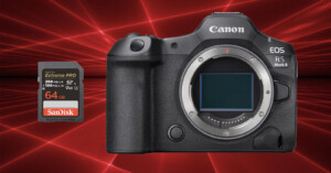 A Canon EOS R5 Mark II camera body without a lens is displayed next to a 64GB SanDisk Extreme PRO memory card. The background features a dynamic red laser light pattern.