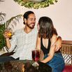 Smiling couple embracing during date at night club