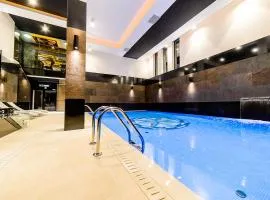 Arena Hotel Spa & Wellness، فندق في تيخي