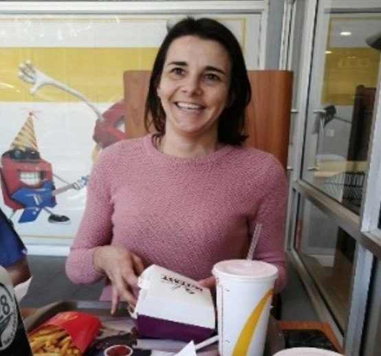 Person enjoying McDonald's after DBS surgery.