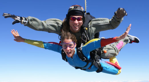 Image of two people skydiving