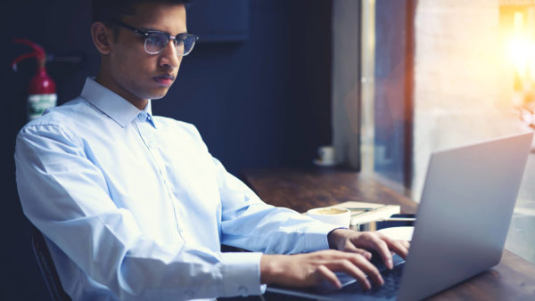 indian_man_reading_screen