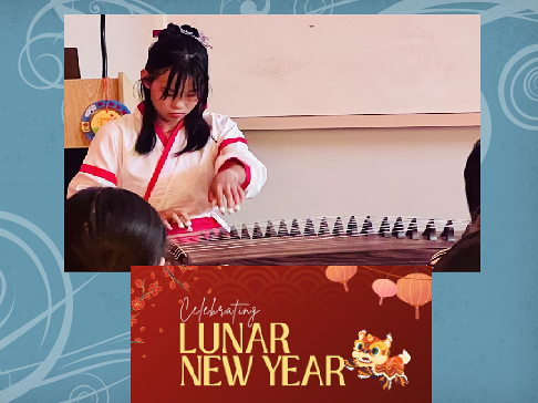 A member plays the traditional Chinese instrument: guzheng