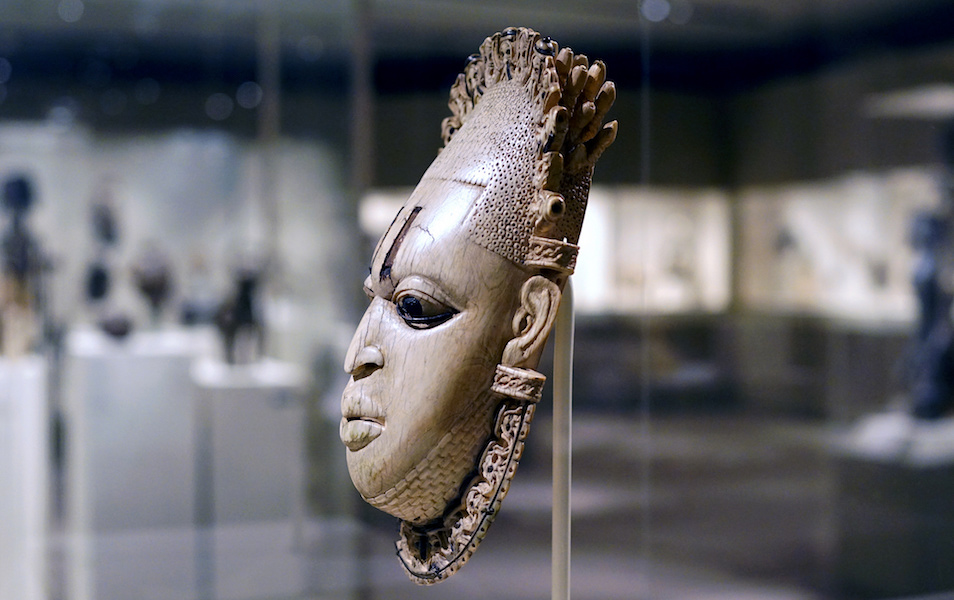 Queen Mother Pendant Mask (Iyoba), 16th century, Edo peoples, Court of Benin, Nigeria, ivory, iron, copper, 23.8 x 12.7 x 8.3 cm (The Metropolitan Museum of Art)