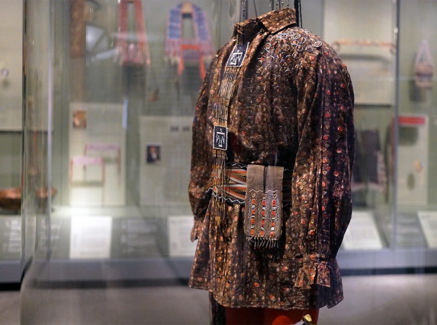 Anishinaabe outfit, c. 1790, collected by Lieutenant Andrew Foster, Fort Michilimackinac (British), Michigan, birchbark, cotton, linen, wool, feathers, silk, silver brooches, porcupine quills, horsehair, hide, sinew; the moccasins were likely made by the Huron–Wendat people (National Museum of the American Indian, Smithsonian Institution, Washington, D.C.)