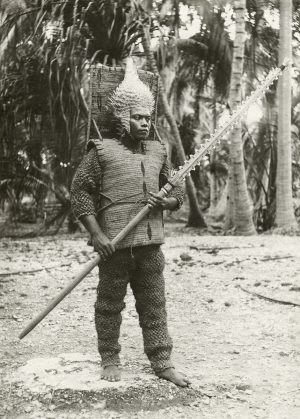 One of the senior students at Rongorongo training college, Beru, wearing Kiribati armor, before 1925 (Photo: George Hubert Eastman, © Museum of Archaeology and Anthropology, University of Cambridge)