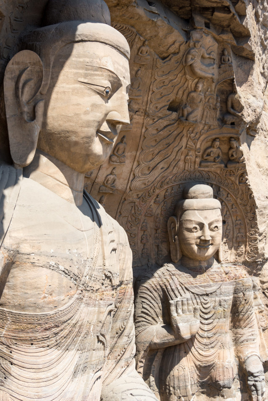 Buddha (left) and attendant (right), Cave 20 at Yungang, Datong, China (photo: xiquinhosilva, CC BY 2.0)