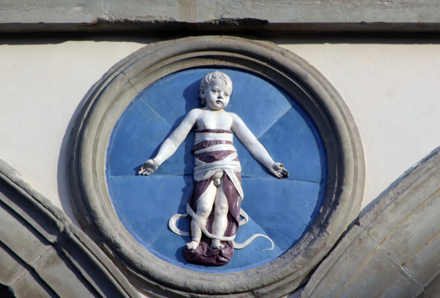 Andrea della Robbia, Infant in Swaddling Clothes, 1487, glazed terracotta, diameter about 100 cm. Ospedale degli Innocenti, Florence. Image: author.