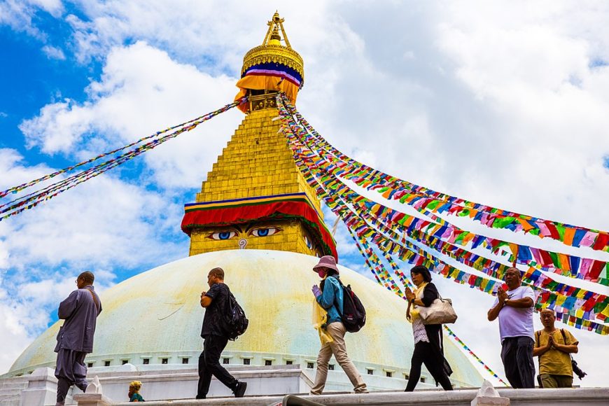 Pilgrims circumambulating the Boudhanath stupa. 14th century. Kathmandu, Nepal. Image by Alina Chan from Wiki Commons.