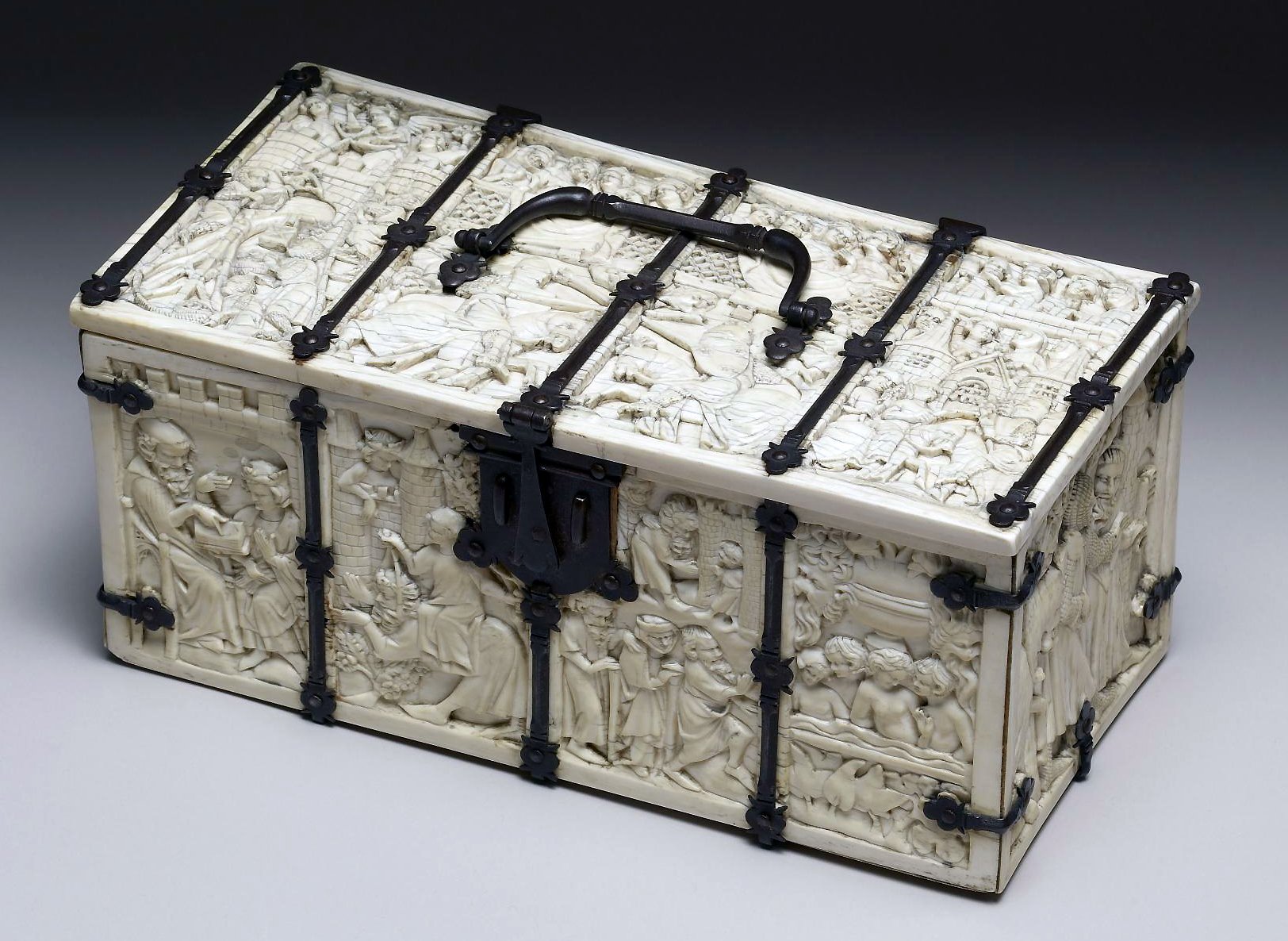 Casket with Scenes of Romances, c. 1330–50, ivory, modern iron mounts, France, 11.8 x 25.2 x 12.9 cm (The Walters)