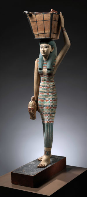 offering bearer, c. 1981–1975 B.C.E. (dynasty 12), Middle Kingdom, wood, gesso, paint, from Egypt, Upper Egypt, Thebes, Southern Asasif, Tomb of Meketre (TT 280, MMA 1101), serdab, MMA excavations, 1920, 112 x 17 cm (The Metropolitan Museum of Art)