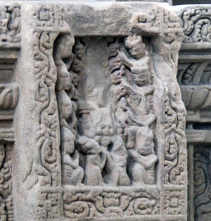 Detail of worshippers before a (now missing) Buddha sculpture. The Buddha's Colossal Altar-Pedestal, 9th century C.E., sandstone, from Đồng Dương temple, Vietnam (Đa Nẵng Museum of Cham Sculpture; photo: Gary Todd, CC0)