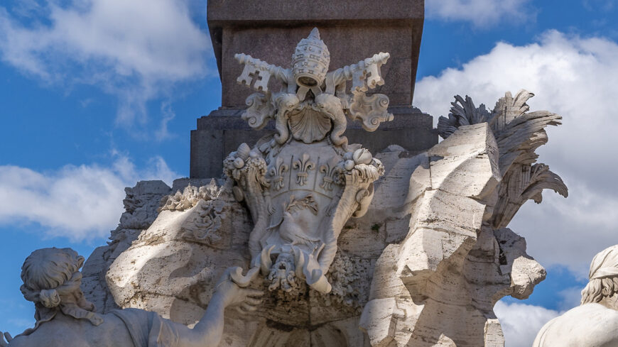 Pamphili family coat of arms (detail), Gian Lorenzo Bernini, Fountain of the Four Rivers (Fontana dei Quattro Fiumi), Piazza Navona, Rome, commission by Pope Innocent X, 1651, marble (photo: Steven Zucker, CC BY-NC-SA 2.0)