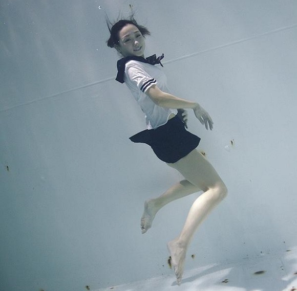 Time to get wet: Underwater photos of girls in sailor suits and… plastic exoskeletons?