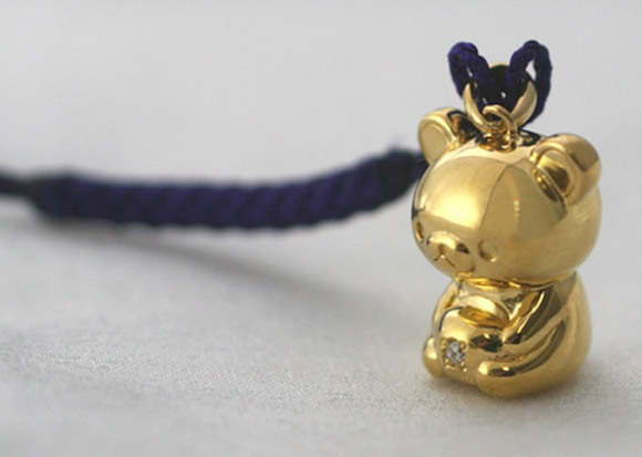 Rilakkuma appears in Japan as a 24-karat solid gold charm with a diamond belly button