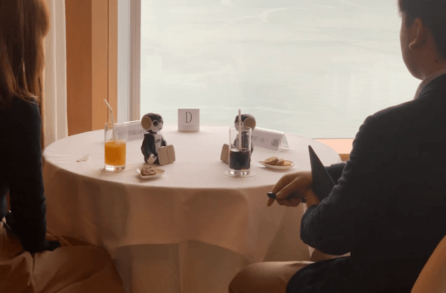 Robot matchmaking party in Japan has couples sit silently, techno cupids make small talk for them