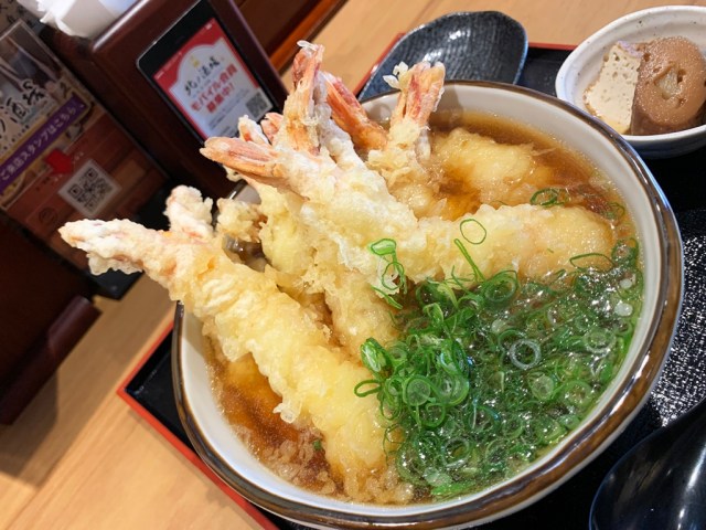 A delicious bowl of Osaka soba stuffed with tempura shrimp that’s also an edible pun