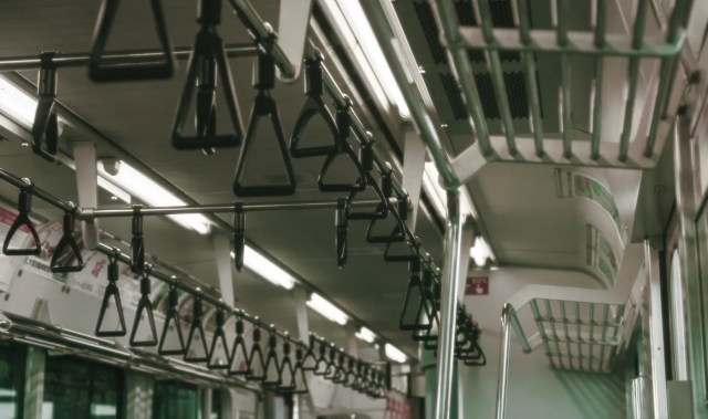 Drunk Japanese politician in trouble for doing pullups inside moving train【Video】