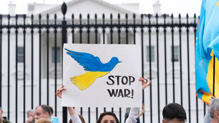 People protest the Russian invasion of Ukraine during a rally outside of the White House in Washington, Sunday, March 6, 2022.