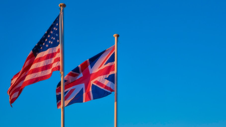 The national flag of the United States of America and the United Kingdom with blue color in background.