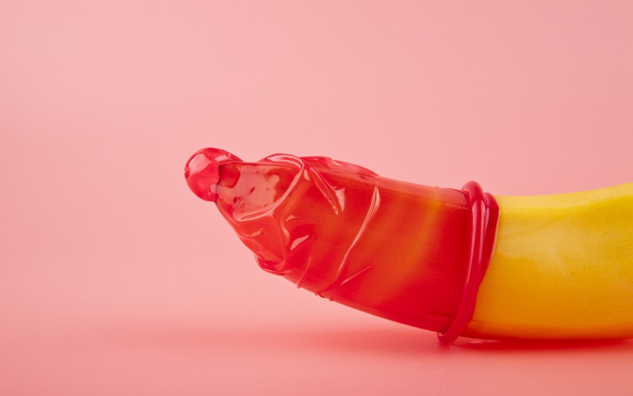 a red condom on a banana