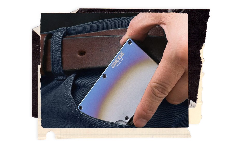 The Ridge Burnt Titanium Wallet in a man's pocket