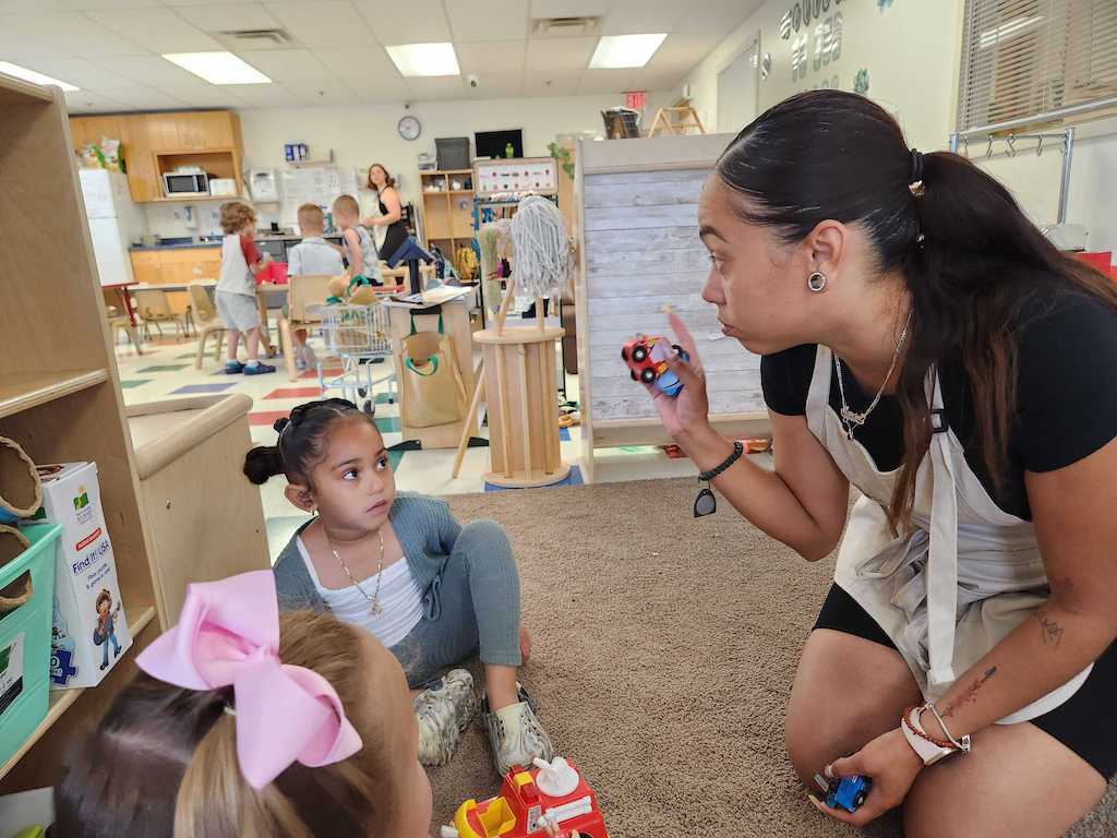 A woman and child at a day care.