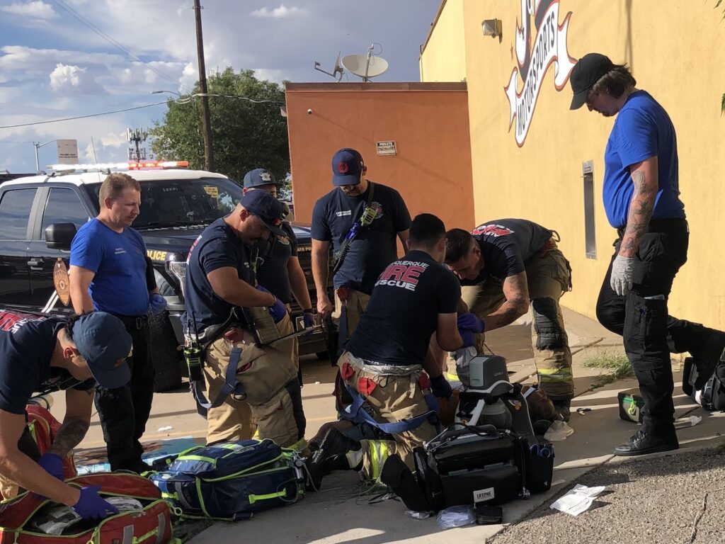 Responders work on a person suffering an apparent overdose.