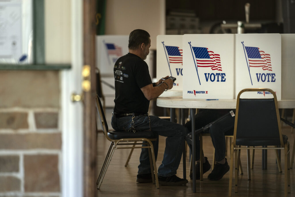 A voter marks their ballot at a polling place in Bristol, Pa.