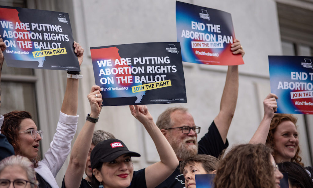 Abortion-rights supporters in Missouri rally after turning in signatures for a ballot measure.