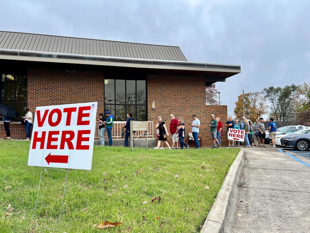 People wait in line at a polling place in Alabama.